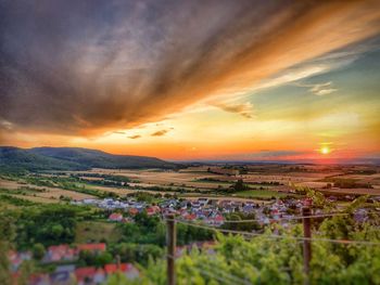 Scenic view of field against sky during sunset