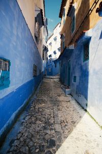 Narrow street amidst buildings in town