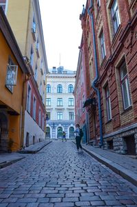 Footpath amidst buildings in town