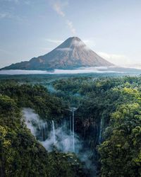 Scenic view of waterfall against sky