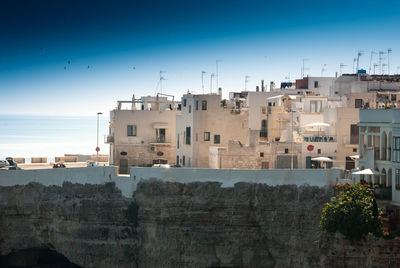 View of cityscape against clear blue sky