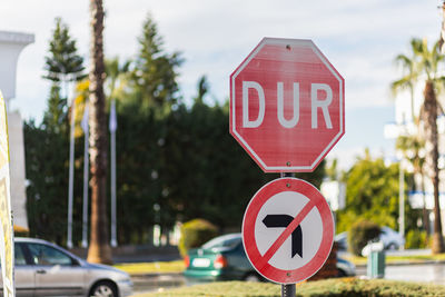 Low angle view of road sign against sky