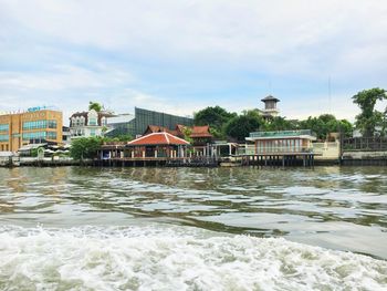 View of sea with buildings in background