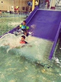 Children playing in swimming pool