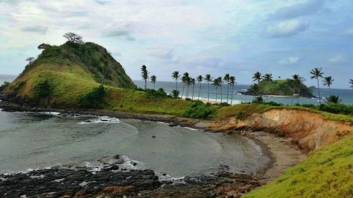 Scenic view of sea against cloudy sky