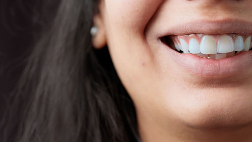 Close-up of smiling woman lips