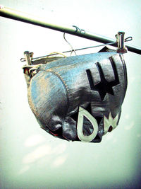 Close-up of old equipment hanging on wall