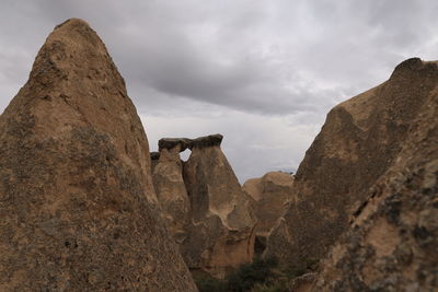 Rock formations on mountain against sky