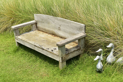 High angle view of an empty bench on field