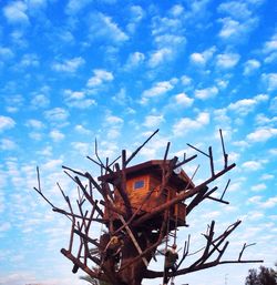 Low angle view of old building against blue sky