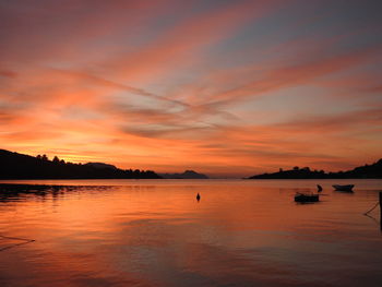 Scenic view of sea against orange sky