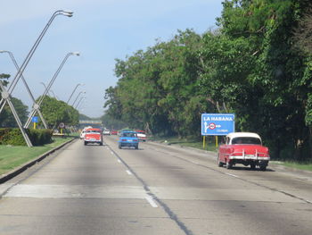 Cars on road against sky