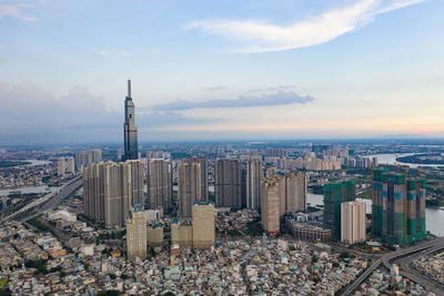 High angle view of modern buildings in city against sky