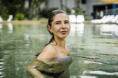 Young woman swimming in pool