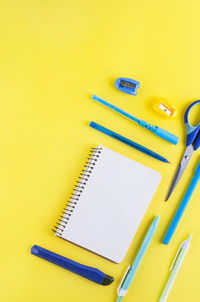 School supplies on yellow background. back to school. 