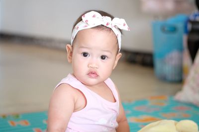 Portrait of cute baby girl at home