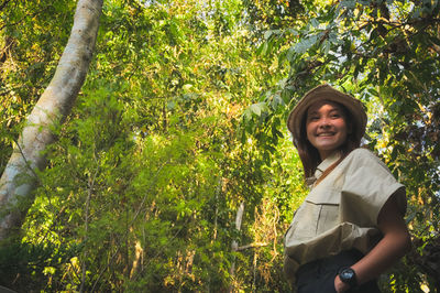 Happy young women surrounded by rainforest  ,  inspiration , freedom and recreation concept