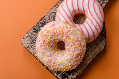 Directly above shot of donut on red background