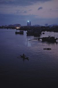 Scenic view of river against sky at dusk