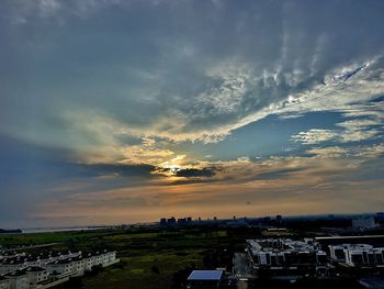 High angle view of buildings against sky at sunset