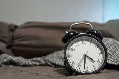 Close-up of clock on table