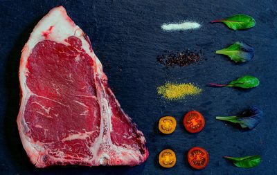 High angle view of red chili peppers on black background