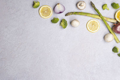 High angle view of chopped fruit against white background