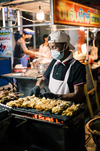 Man preparing food at market