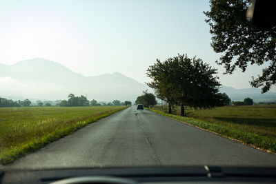 Road seen through car windshield