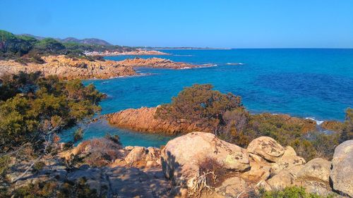 Scenic view of sea against clear blue sky