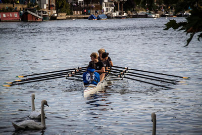 People in boat on lake