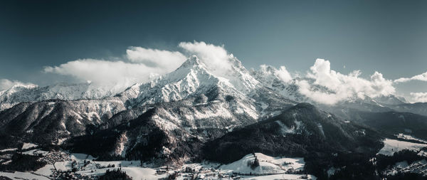 Scenic view of snowcapped mountains against sky