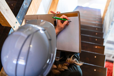 High angle view of man holding toy on table