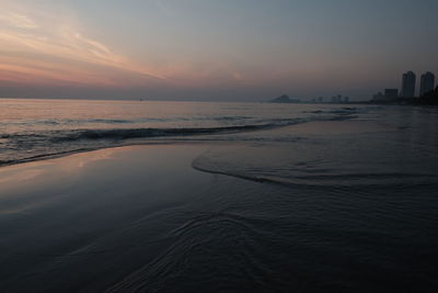 Scenic view of sea against sky at sunset
