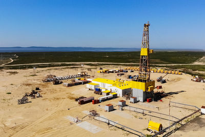 High angle view of cranes against clear sky