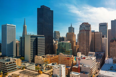 Modern buildings in city against sky