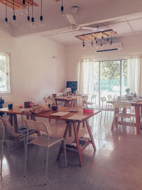 Empty chairs and tables in restaurant