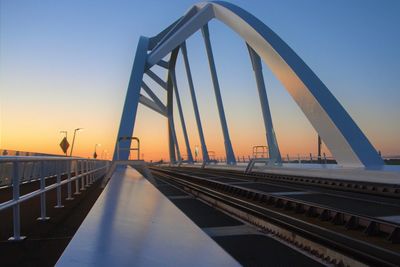 Bridge against clear sky during sunset
