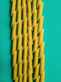 Low angle view of pasta against wall