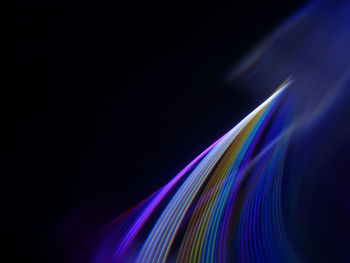 Light trails against black background