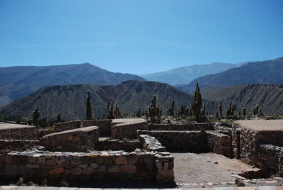 Built structure with mountain range in background