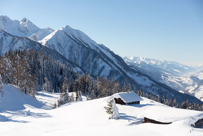 Wooden cabin or hut in the mountains in winter in the austrian alps.