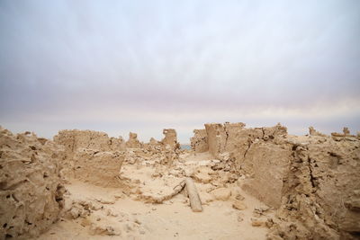 Rock formations in desert against sky