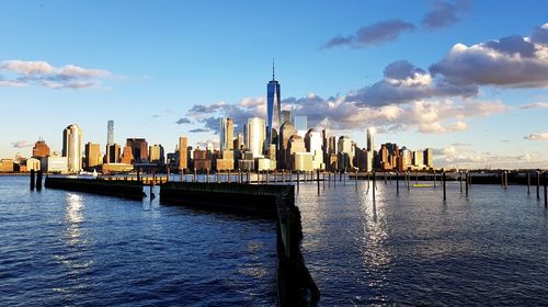 Panoramic view of river and buildings against sky