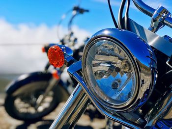Close-up of bicycle wheel against blue sky