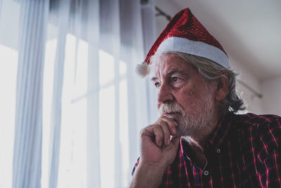 Portrait of man wearing hat looking away