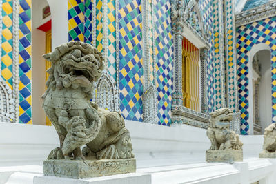 Lion statue in chinese style in the thai temple in the royal grand palace