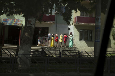 People in front of trees