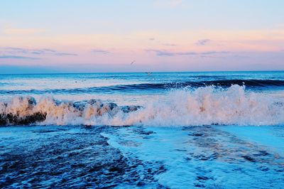 Scenic view of sea against sky at sunset