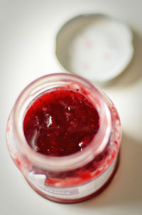 Close-up of red juice on table